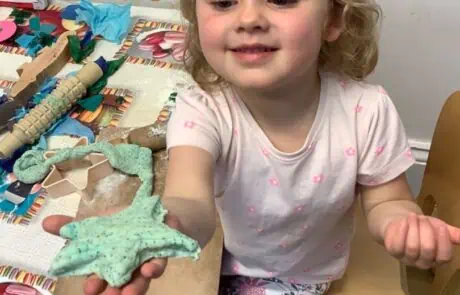 nursery child proud of what she has made from playdoh nursery child proud of what she has made from playdoh